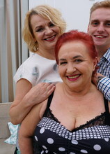 Two mature ladies sharing a young guy in an anal threesome