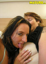 Mature lesbians having fun on the bed