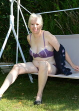 Horny British mature lady playing in the garden