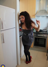 Naughty Spanish housewife playing in her kitchen