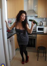 Naughty Spanish housewife playing in her kitchen