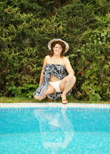 This big housewife gets naughty at the pool