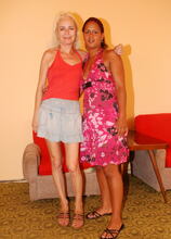 Interracial old and young lesbians at play