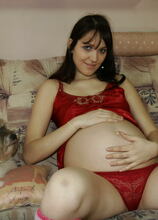 Pregnant teeny gets a special visit from a mature slut
